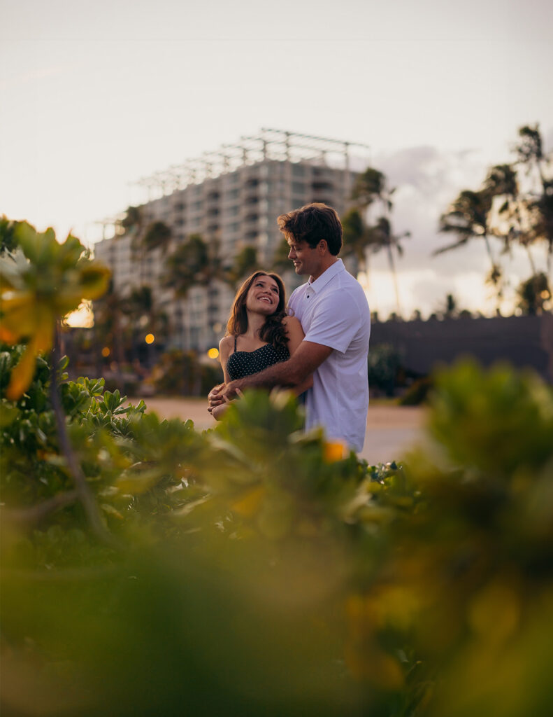 couple standing next to Kahala resort