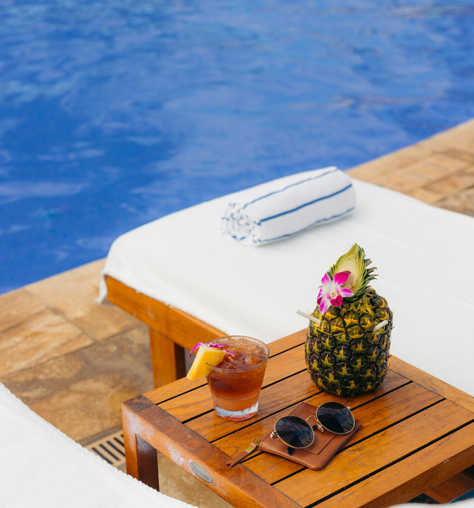 pineapple on a table near pool